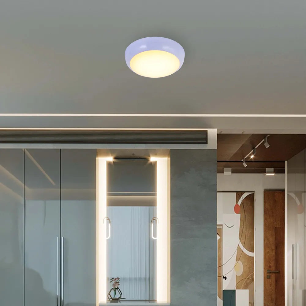 LED flush ceiling light with a white rim, perfect for modern kitchens or entryways, adding bright illumination and a sleek design.118-03616