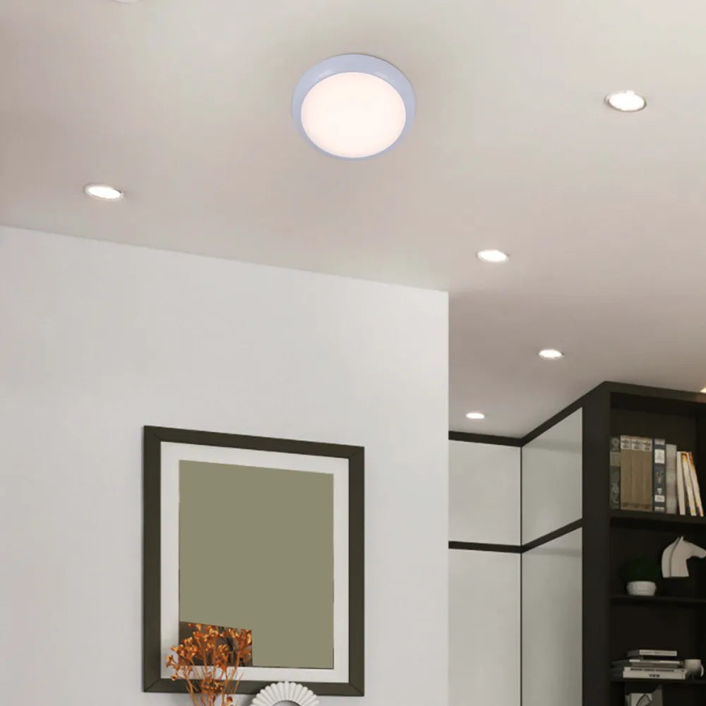 LED flush ceiling light in a modern bathroom setting, featuring a sleek white rim and versatile 3CCT for customizable ambiance.118-03618