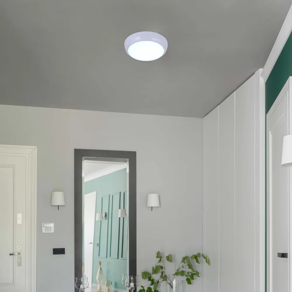 Modern LED flush ceiling light with a white rim, enhancing a stylish hallway with contemporary decor and IP54 waterproof design.118-03622