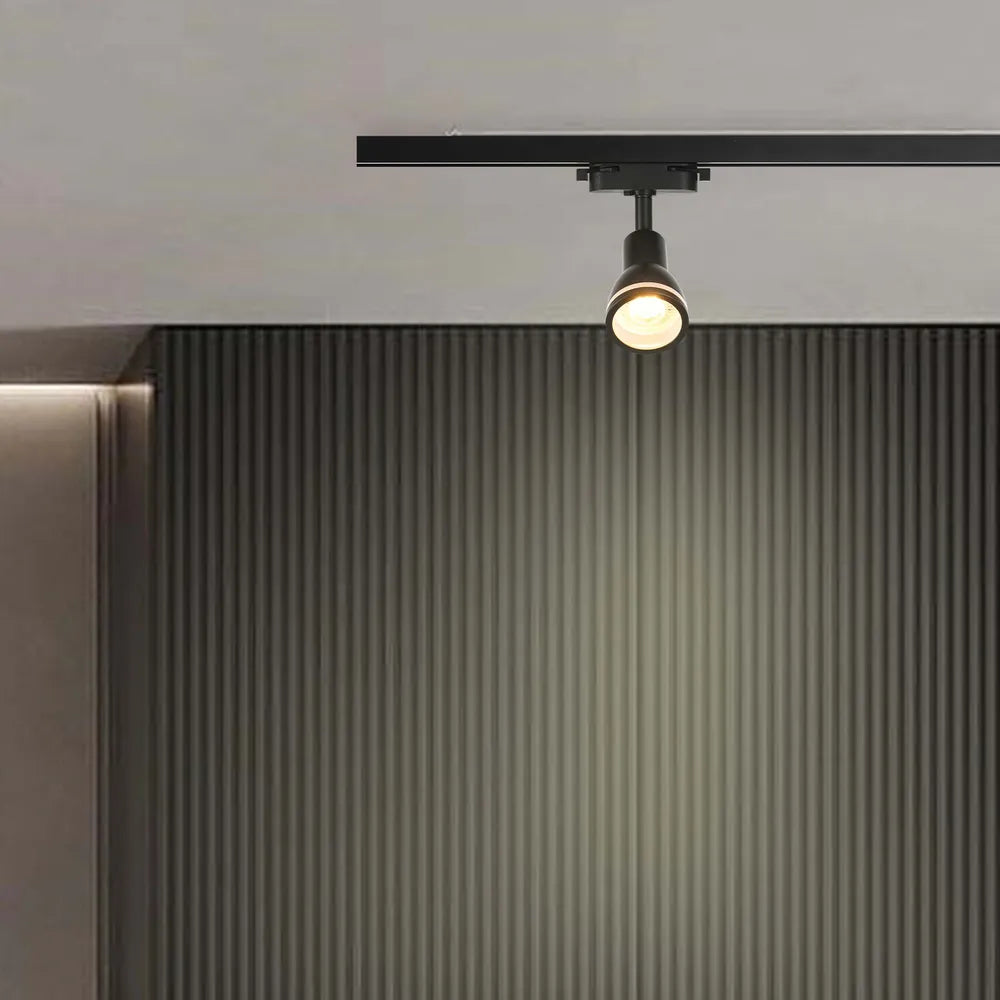 Modern GU10 track light showcasing sleek design, illuminating a stylish living room with contemporary decor and minimalist furnishings.173-03016