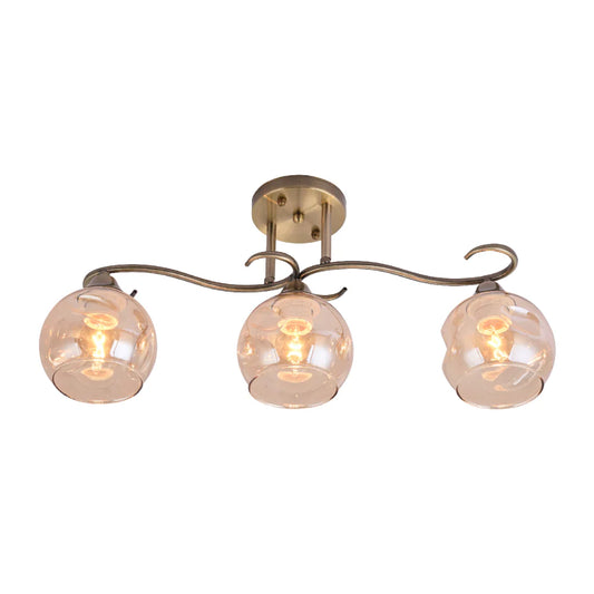S-Curve Antique Brass and Dimpled Amber Globe Light
