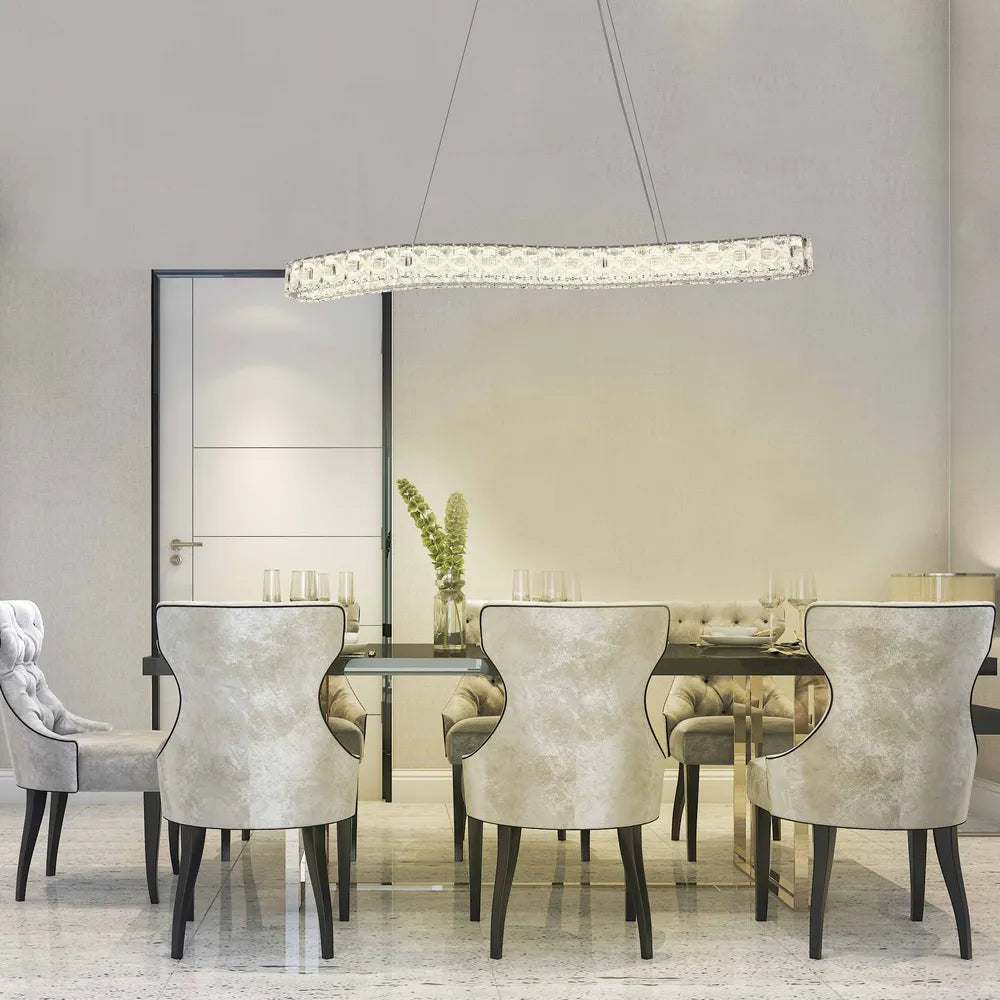 Elegant crystal chandelier illuminates a modern dining room, enhancing the space with luxury and sophistication in ambient lighting.159-18348