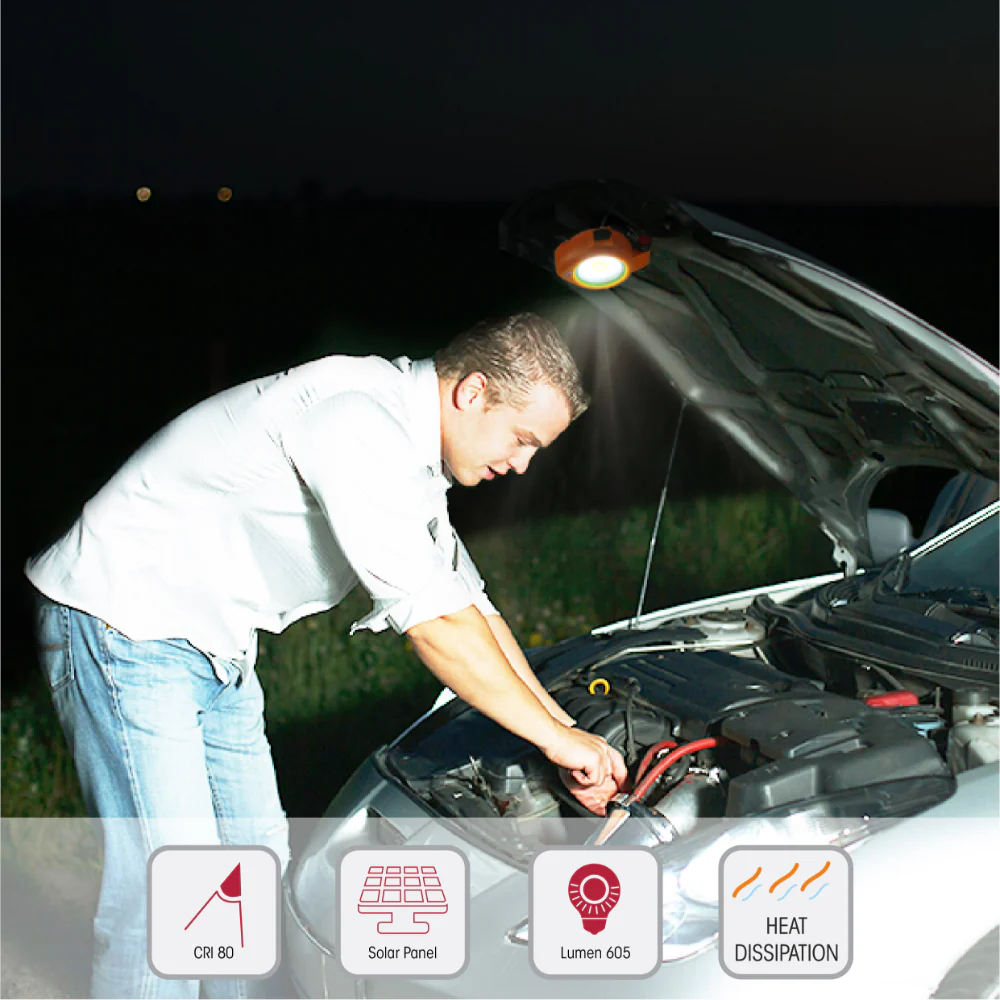 man fix car using SolarFlex Multi-Purpose Portable Floodlight flashlight as a portable light