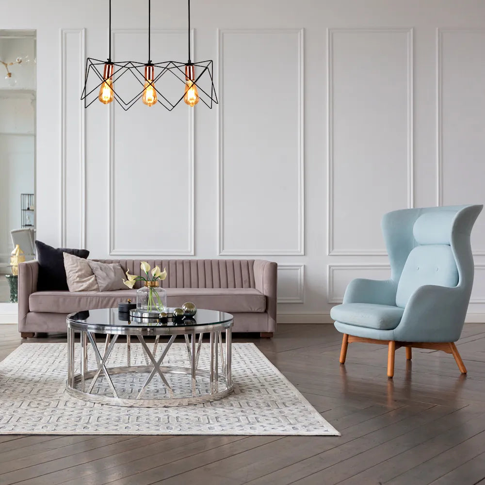 Rose gold and black metal cage pendant light adds a modern touch to a stylish dining area with minimalistic decor.159-17028